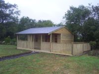 20x16 Pavilion with an additional 8x16 decking area. Fitted with a felt tile roof.