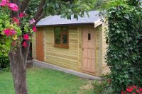 Garden building with a personal door, u-PVC window and a hardwood door. Featuring a partition to separate the shed area & grey felt tiles