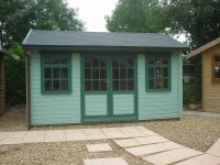 14 x 10 Orchard Room with standard doors and windows, plus grey felt tiles. Please note that the customer painted the building.